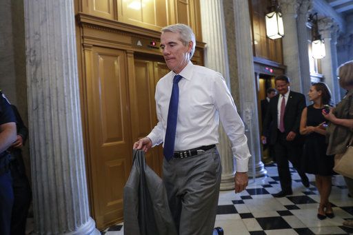 Sen. Rob Portman, R-Ohio, arrives for a vote as the Republican-run Senate rejected a GOP proposal to scuttle President Barack Obama's health care law and give Congress two years to devise a replacement, Wednesday, July 26, 2017, at the Capitol in Washington. President Donald Trump and Senate Majority Leader Mitch McConnell, R-Ky., have been stymied by opposition from within the Republican ranks.