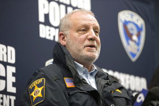 McHenry County Sheriff Bill Primm speaks during a news conference, Thursday, March 7, 2019, at the Rockford Police Department District 3 Headquarters in Rockford, Ill. Floyd E. Brown suspected of fatally shooting a sheriffâ€™s deputy and wounding a woman at an Illinois hotel was taken into custody Thursday after an hours-long standoff that began when he crashed his vehicle along an interstate highway, authorities said. (Scott P. Yates/Rockford Register Star via AP)