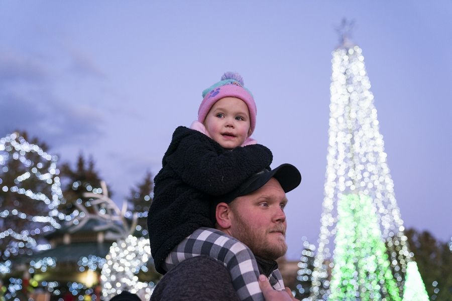 Andrew Pedersen and his daughter, Adalynn, 4, of Wheeling, enjoy the lights Sunday during the Lights Around Wheeling event at Friendship Park in Wheeling.