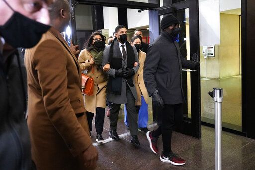 Actor Jussie Smollett, center, leaves to the Leighton Criminal Courthouse, Thursday, Dec. 9, 2021, in Chicago, following a verdict in his trial. Smollett was convicted Thursday on five of six charges he staged an anti-gay, racist attack on himself nearly three years ago and then lied to Chicago police about it.