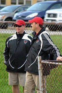 Daily Herald File PhotoNaperville Central coach Ed Watson, right, talks with assistant coach Barry Baldwin. Watson is retiring after the season, his 30th as Redhawks coach.