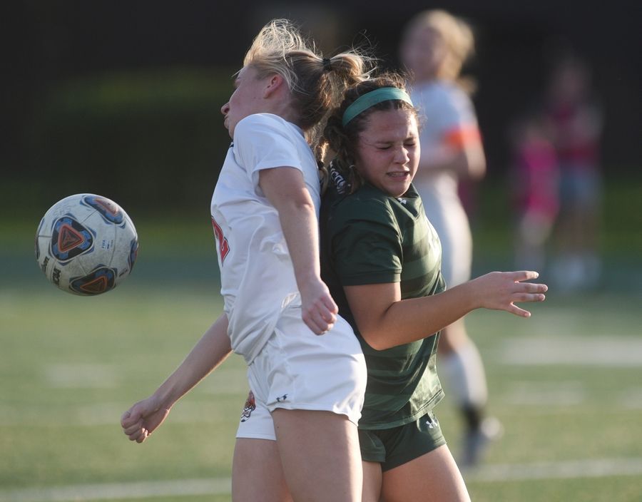 Libertyville's Riley Brennan, left, and Stevenson's Arria Chavez collide wile chasing down the ball during Monday's girls soccer game in Lincolnshire.