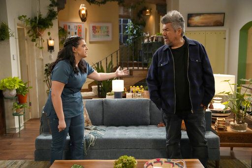 This image released by NBC shows Mayan Lopez, left, and George Lopez in a scene from "Lopez vs Lopez," a new comedy series debuting this fall. (Casey Durkin/NBC via AP)