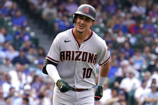 Arizona Diamondbacks' Josh Rojas smiles as he rounds the bases after hitting a solo home run during the seventh inning of a baseball game against the Chicago Cubs in Chicago, Friday, May 20, 2022.