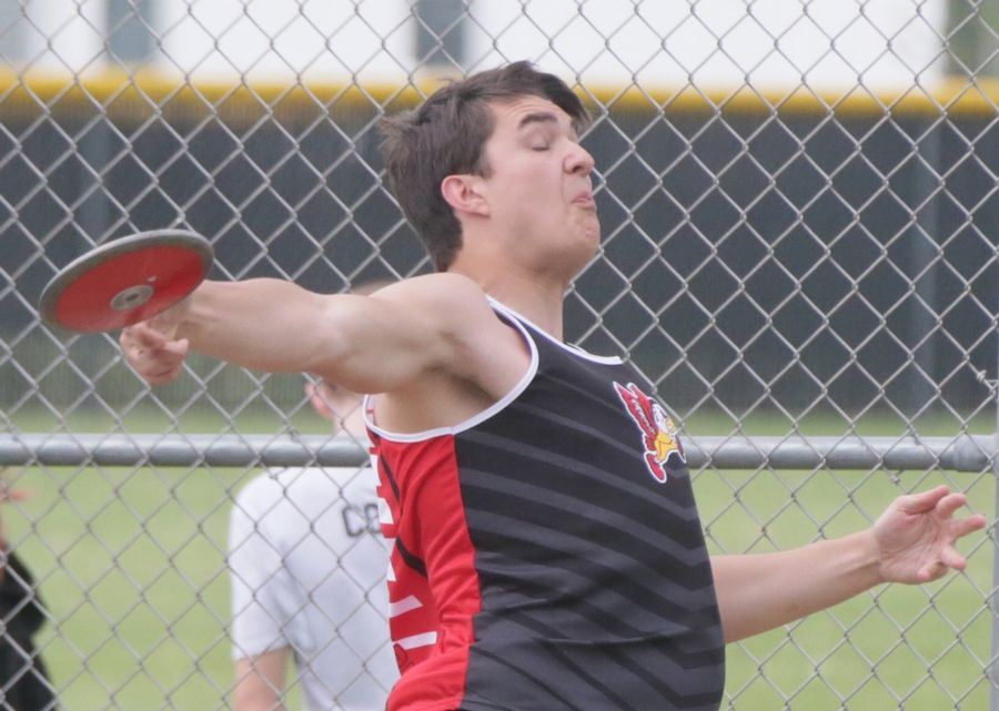 Benet Academy's Aiden Dentice throws discus in the Class 1A Boys Sectional track meet on Friday, May 20, 2022 in Plano.