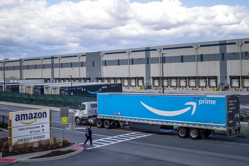FILE - A truck arrives at the Amazon warehouse facility on the Staten Island borough of New York, April 1, 2022. Amazon is planning to sublease some of its warehouse space because the pandemic-fueled surge in online shopping has slowed.