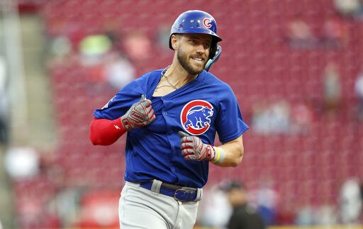 Chicago Cubs' Patrick Wisdom runs the bases after hitting a three-run home run against the Cincinnati Reds during the fourth inning of a baseball game in Cincinnati, Monday, May 23, 2022.
