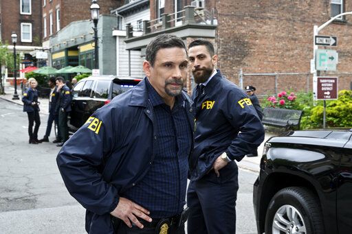 This image released by CBS shows Jeremy Sisto as Assistant Special Agent in Charge Jubal Valentine and Zeeko Zaki as Special Agent Omar Adom "OA" Zidan in a scene from the season finale of  the series "FBI." CBS has pulled the season finale episode after a deadly elementary school shooting in Texas. (David M. Russell/CBS via AP)