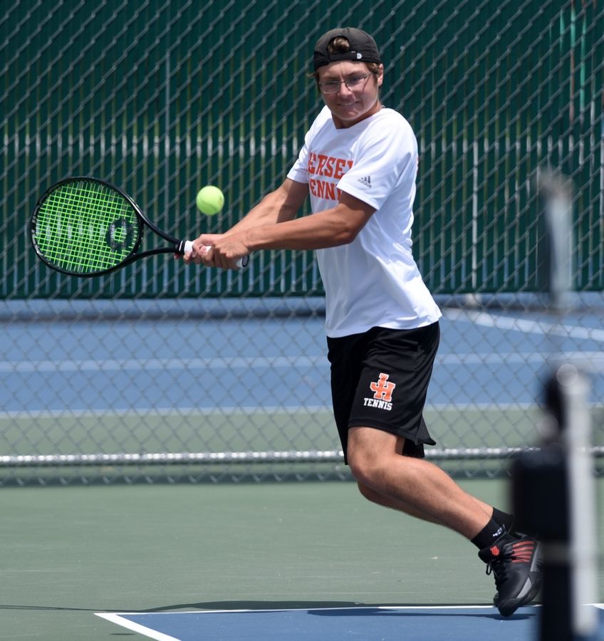 Hersey's Mitch Sheldon plays a hard serve during Saturday's state tennis tournament.