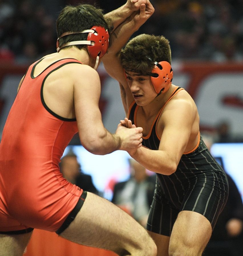 Crystal Lake Central senior Dillon Carlson, right, battles with Benjamin Shvartsman in the 160-pound championship bout of the state wrestling finals.