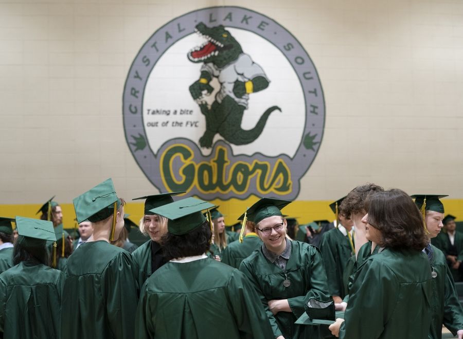 Graduates gather in the gym before commencement ceremonies for the class of 2022 at Crystal Lake South High School.