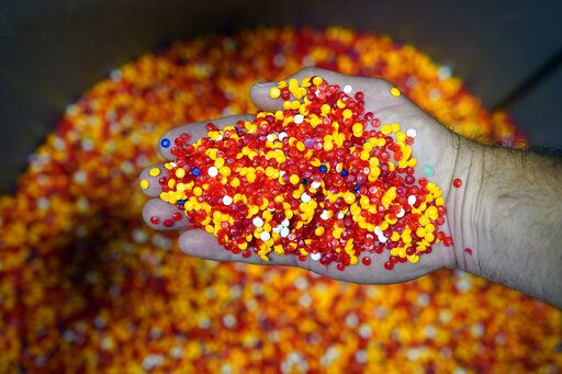A mix of colored vinyl pellets that will be made into records is stored in a bin at the United Record Pressing facility Thursday,  June 23, 2022, in Nashville, Tenn. Colored pellets are used by themselves or in a variety of combinations to create colorful records in addition to the traditional black vinyl.