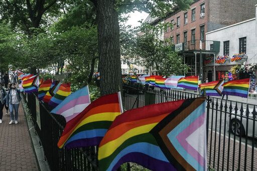 Flags affirming LGBTQ identity dress the fencing surrounding the Stonewall National Monument, Wednesday, June 22, 2022, in New York. Sunday's Pride Parade wraps a month marking the anniversary of the June 28th, 1969, Stonewall uprising, sparked by a police raid on a gay bar in Manhattan and a catalyst of the modern LGBTQ movement.