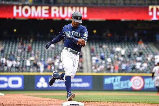 Seattle Mariners' Julio Rodriguez rounds the bases after hitting a two-run home run against the Baltimore Orioles during the fourth inning of a baseball game, Wednesday, June 29, 2022, in Seattle.