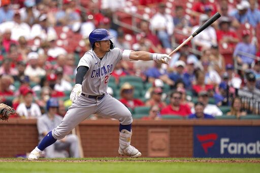 Chicago Cubs' Seiya Suzuki reaches on an throwing error by St. Louis Cardinals shortstop Paul DeJong during the eighth inning in the first game of a baseball doubleheader Thursday, Aug. 4, 2022, in St. Louis.