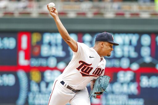 Minnesota Twins starting pitcher Chris Archer throws to the Toronto Blue Jays in the first inning of a baseball game Sunday, Aug. 7, 2022, in Minneapolis.