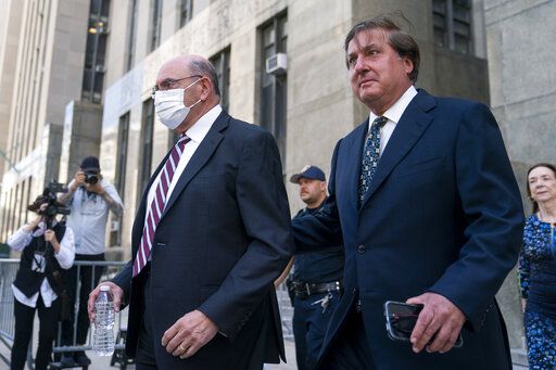 The Trump Organization's former Chief Financial Officer Allen Weisselberg, left, departs court, Friday, Aug. 12, 2022, in New York. Capping an extraordinary week in Donald Trump's post-presidency, a New York judge ordered Friday that his company and its longtime finance chief stand trial in the fall on tax fraud charges stemming from a long-running criminal investigation into Trump's business practices.
