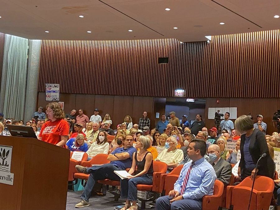An overflow crowd attends Tuesday's Naperville City Council meeting to weigh in on a proposed ordinance banning the sale of certain high-powered rifles.