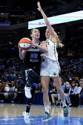 Chicago Sky guard Courtney Vandersloot, left, drives to the basket against New York Liberty guard Marine Johannes during the second half in Game 1 of a WNBA basketball first-round playoff series Wednesday, Aug. 17, 2022, in Chicago. The Liberty won 98-91.