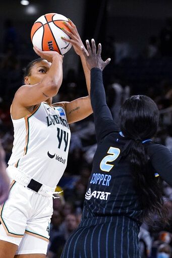 New York Liberty forward Betnijah Laney, left, shoots over Chicago Sky guard Kahleah Copper during the first half in Game 1 of a WNBA basketball first-round playoff series Wednesday, Aug. 17, 2022, in Chicago.