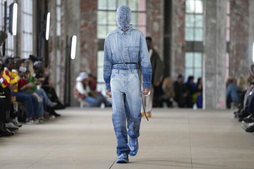 A model wears a creation for Botter for the ready-to-wear Spring/Summer 2023 fashion collection presented Tuesday, Sept. 27, 2022 in Paris.