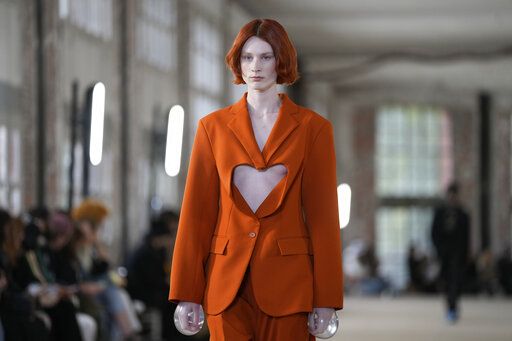 A model wears a creation for Botter for the ready-to-wear Spring/Summer 2023 fashion collection presented Tuesday, Sept. 27, 2022 in Paris.