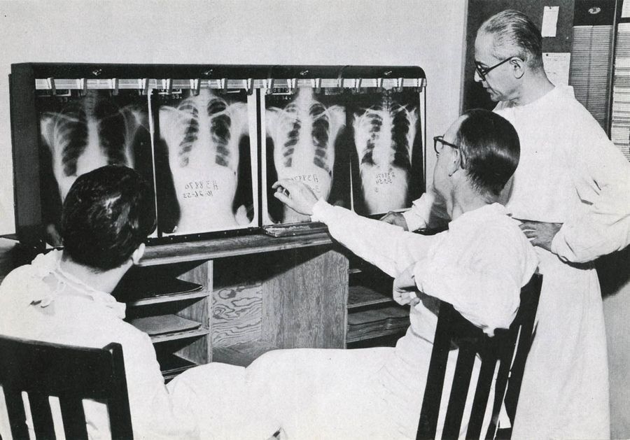 Doctors at the Edward Sanatorium in Naperville, circa the late 1940s or early 1950s, inspecting X-rays for signs of tuberculosis.