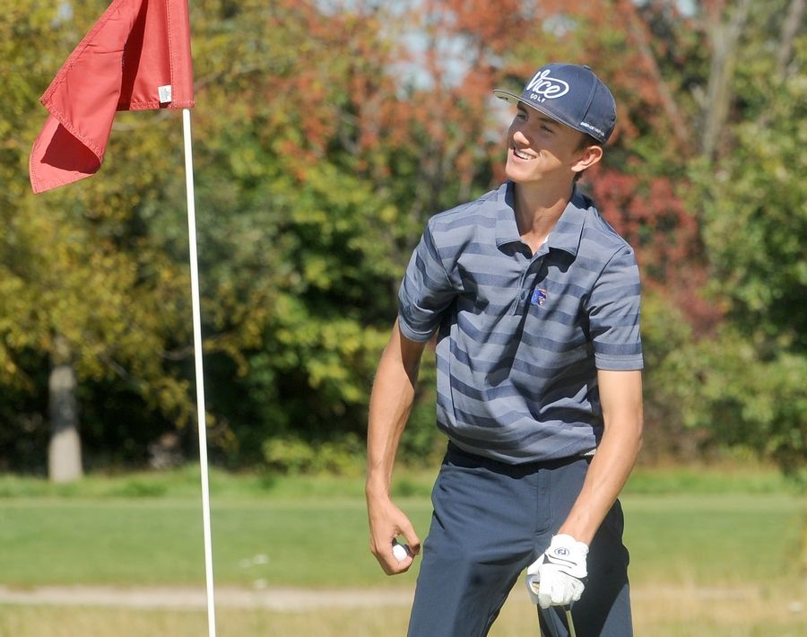 Oswego's Brady Monahan cracks a smile after chipping into the hole on the 2nd green during the Class 3A Oswego Boys Golf Sectional at Blackberry Oaks Golf Course in Bristol on Monday, Oct. 3, 2022.